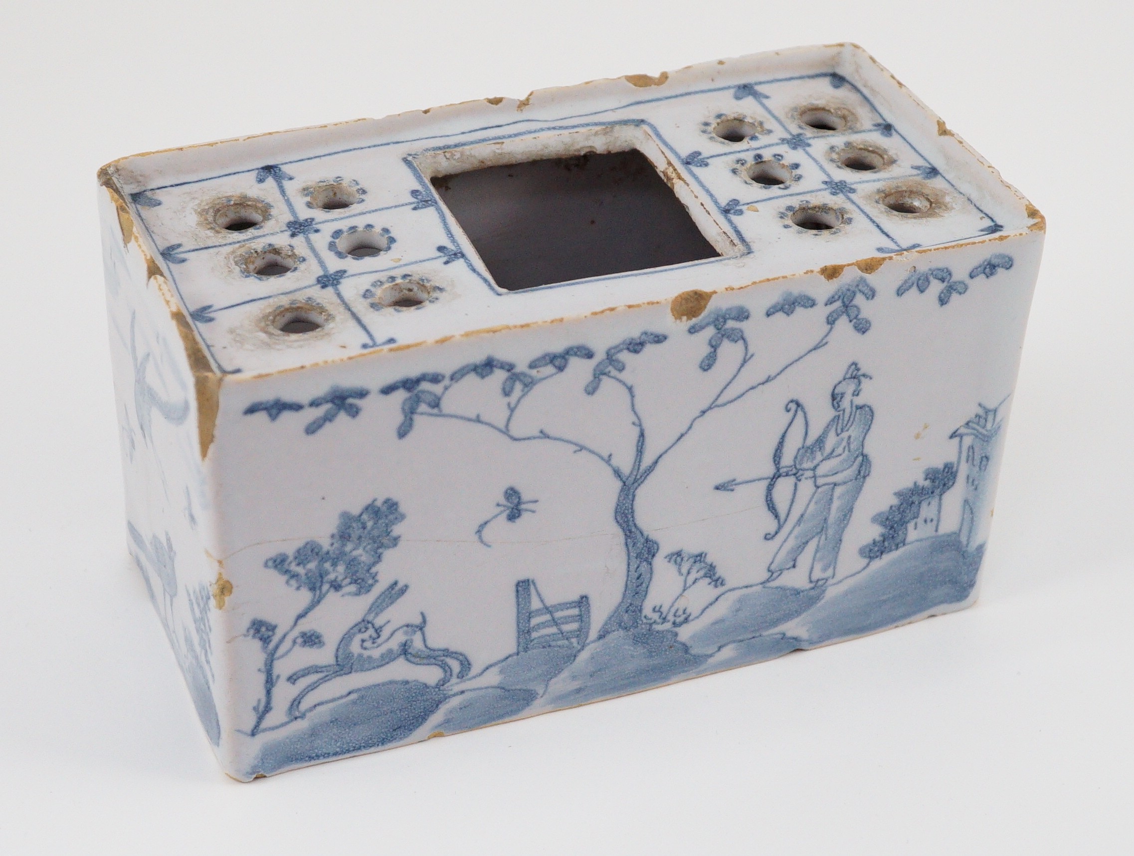 An English delftware flower brick, mid 18th century, 14.5cm wide, chips and crack